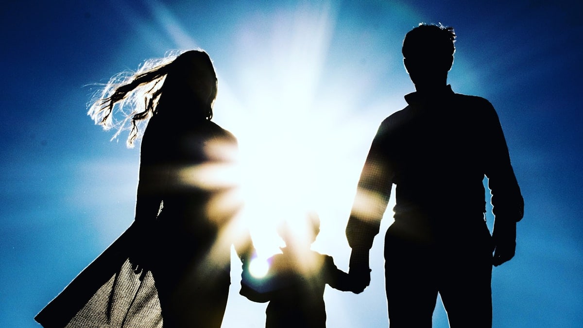 man and woman holding hands